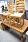 A traditional pine kitchen table, approx 151 x 91cm and a set of four rush seated ladder back