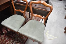 A pair of Victorian mahogany balloon back dining chairs