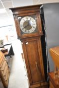 An early 20th Century oak long case clock, height approx. 183cm