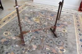 A traditional mahogany tapestry stand having turned frame
