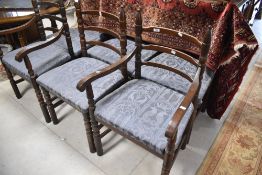 A set of six (four plus two) mid to late 20th Century oak ladder back dining chairs having