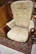 A vintage Ercol wingback armchair