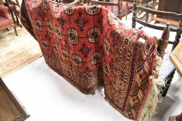 A traditional Persian rug having red ground, approx. 180 x 135cm