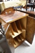 A mid 20th Century walnut record cabinet