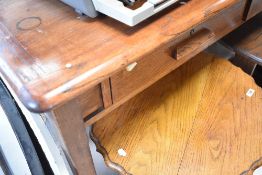 An early 20th Century oak desk/table having two frieze drawers, approx 136cm x 76cm