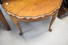A mid 20th Century golden oak occasional coffee table, diameter approx. 61cm