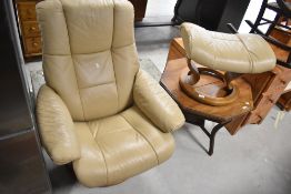 A cream leather Stressless recliner chair and a similar footstool