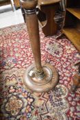 A traditional oak standard lamp