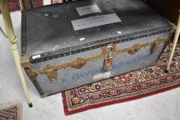 A vintage metal storage trunk