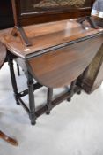 An early 20th Century mahogany gateleg dining table, width approx. 73cm