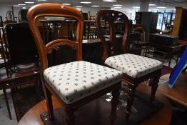 A pair of Victorian mahogany balloon back dining chairs