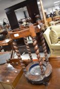 An early 20th Century oak stick stand of twist design