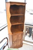 A Cryer Craft Elm corner display with cupboard under