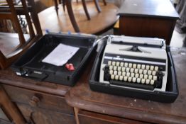 A vintage typewriter, in case, Adler Gabrielle 25