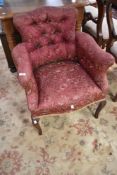 An early 20th Century button back tub chair