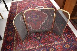 A modern trifold spark guard