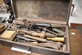 A vintage toolbox and contents