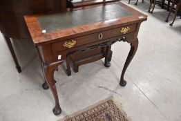 A Georgian and later mahogany side table having leather inset top with frieze drawer and cabriole