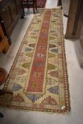A traditional carpet runner , approx. 277 x 73cm