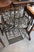 A metalwork wine rack, approx height 67cm, for 15 bottles