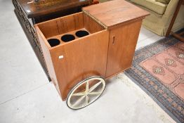 A vintage mid Century teak bar cart in the style of Jacques Adnet, approx. 80 x 35cm