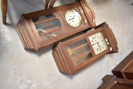 Two early to mid 20th Century oak wall clocks