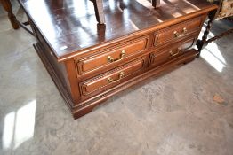 A modern hardwood coffee table with drawers