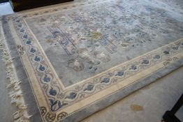 A large Chinese carpet square having blue/grey ground, approx. 12 x 9 feet, with some marks