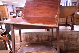 An Edwardian mahogany fold over occasional tea table with inlaid musical decoration and shaped