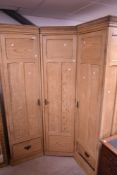 A stripped pine corner robe having dentil cornice and brass handles, overall dimensions approx. W157