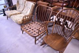 A modern Ercol lounge suite in mid to dark colour comprising two settees, armchair and rocking