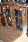 A modern hardwood wall display of small proportions approx height 61cm