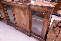 A 19th Century mahogany/kingswood Empire style breakfront display cabinet having central enclosed