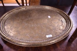 A 19th century heavy gauge Chinese brass oval platter, with moulded rim, the slightly dished
