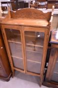 A late 19th or early 20th Century narrow gold oak bookcase , height approx 140cm, width 66cm