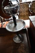 A vintage chrome smokers stand