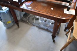 A Victorian mahogany extending dining table , approx W103, length 111 plus three additional leaves