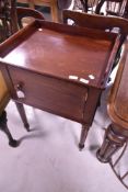 A Victorian mahogany pot cupboard having gallery to top, width approx. 56cm