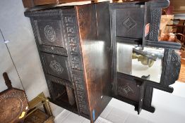 An 18th century and later oak dressing table, adapted from old carved timbers 132cm x 115cm