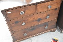 A Victorian stained pine chest of two over two drawers