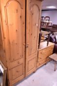 A modern pine wardrobe and bedroom chest
