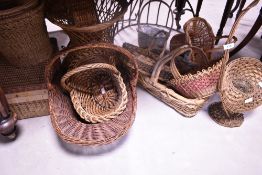 A large collection of wicker baskets etc