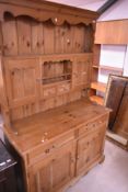 A modern pine kitchen dresser, approx. W122 H196cm