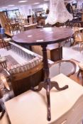 A 19th century mahogany pedestal or stem table, the circular one piece top above a turned column and