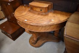 A Victorian satinwood demi lune dressing table