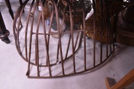 Two cast iron wall hay racks