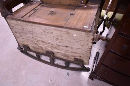 An interesting and unusual wooden rocking washing machine having cast metal rockers