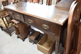 An Arts and Crafts oak dresser base, width approx 151cm