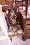 A 19th Century mahogany framed hall chair , having woolwork seat and back panel