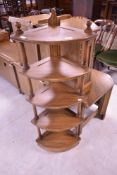 Three modern Ercol dark to mid stain corner shelves